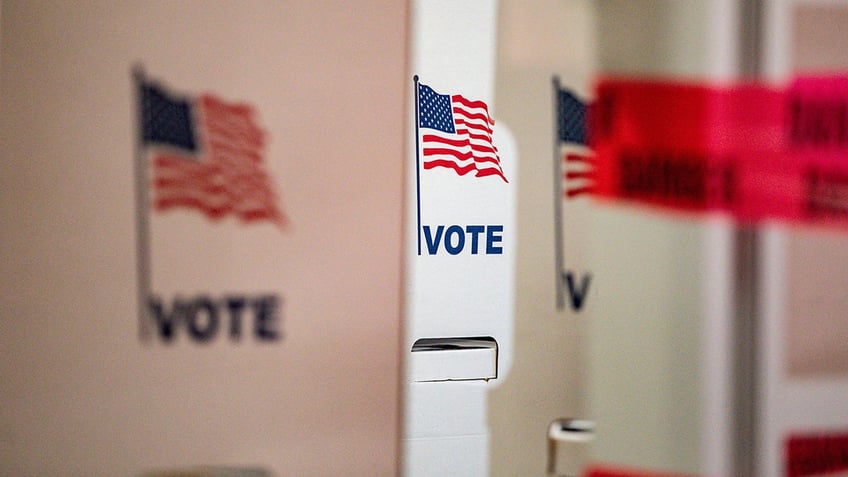 Voting booths stand during the 2024 U.S. presidential election on Election Day