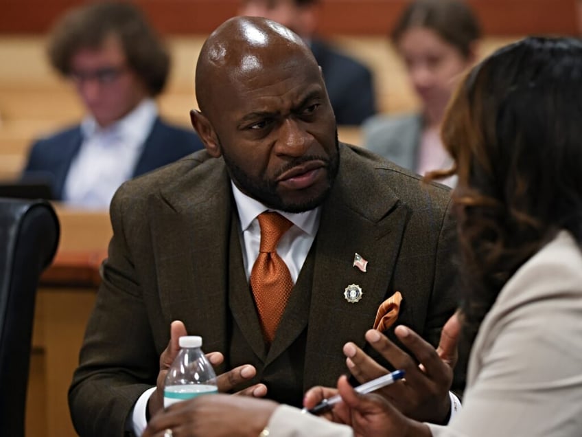 ATLANTA, GEORGIA - OCTOBER 10: Special Prosecutor Nathan Wade speaks with Fulton County Executive District Attorney Daysha Young as they appear before Judge Scott McAfee in a hearing related to the Fulton County 2020 election interference case on October 10, 2023 in Fulton County Superior Court in Atlanta, Georgia. (Photo by Alyssa Pointer-Pool/Getty Images)