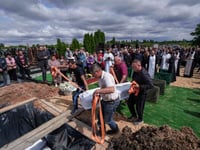 Funeral of 3 siblings killed in Russian strike underscores mounting toll on Ukrainian families