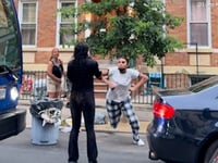 Furious mother-daughter duo viciously attacks driver for moving trash cans reserving parking spot: video