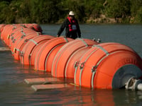 Future of Texas’ migrant-blocking buoys may hinge on whether the Rio Grande is ‘navigable’