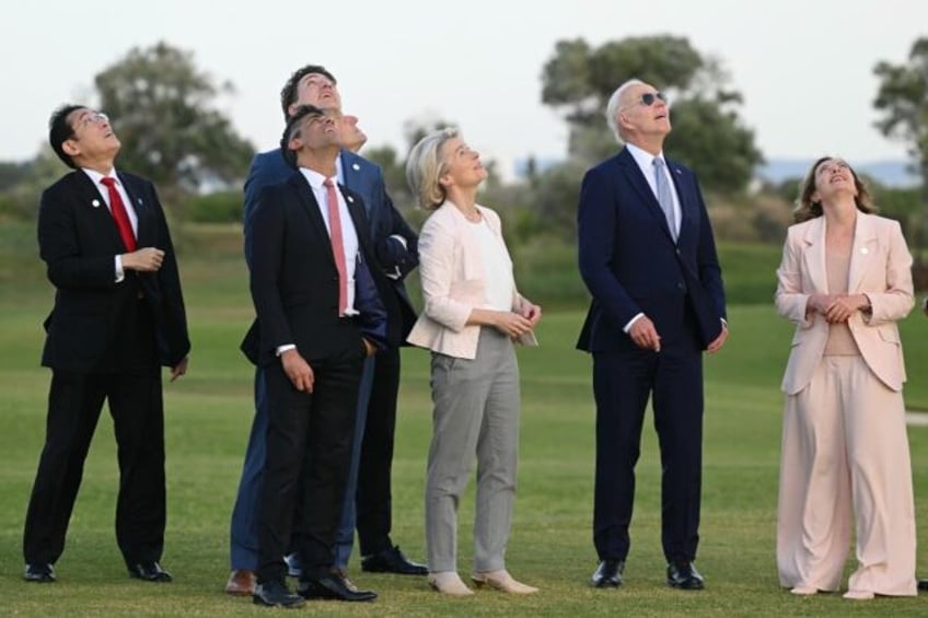 G7 leaders attend a skydiving demonstration at the San Domenico Golf Course in Savelletri,