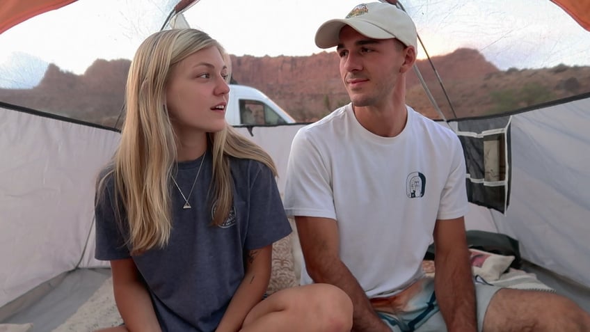 Gabby Petito and Brian Laundrie share a look while sitting in a tent