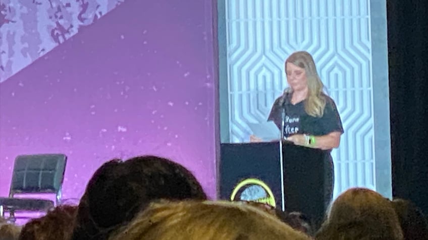 Nichole Schmidt on stage at CrimeCon 2024