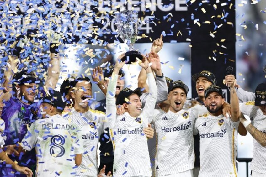 Los Angeles Galaxy players celebrate reaching this weekend's MLS Cup final, a year after t