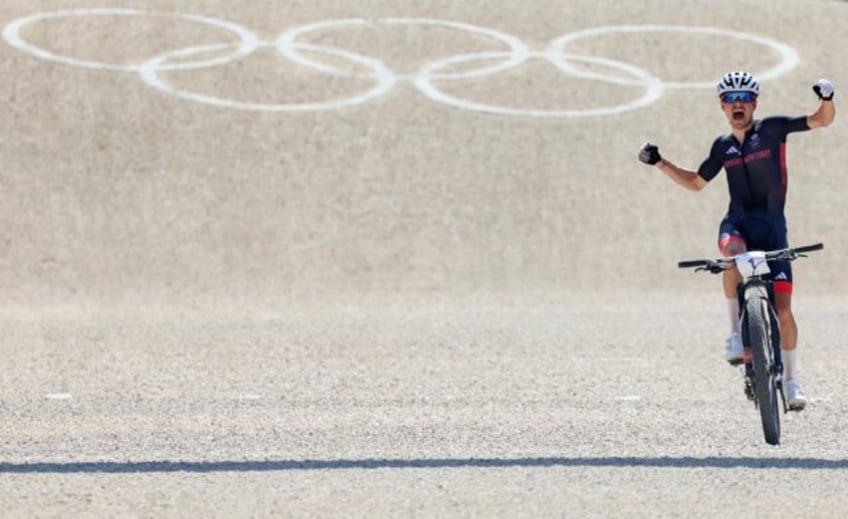 Golden day: Tom Pidcock celebrates his victory in the 2024 Olympic mountain bike event