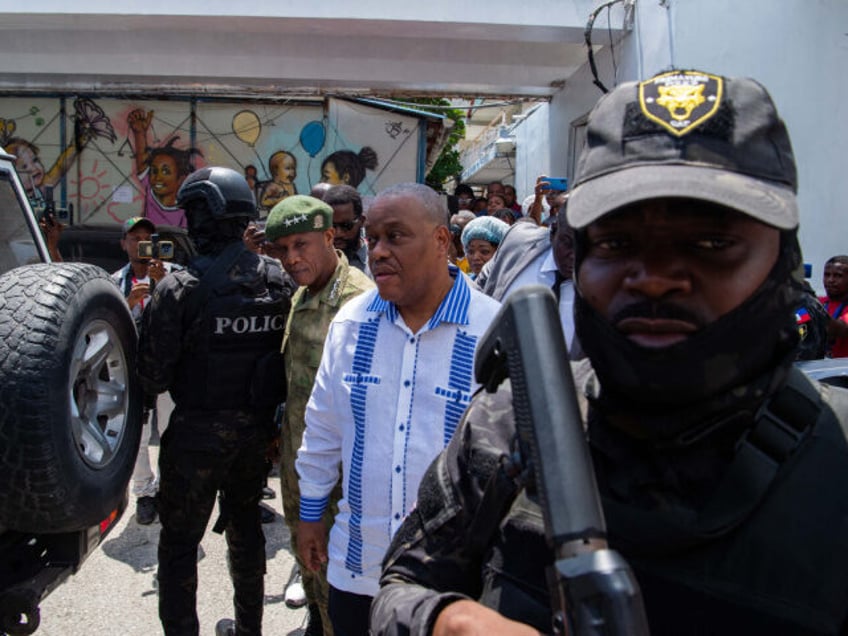 Haitian Prime Minister Gary Conille visits police officers injured during anti gang operat