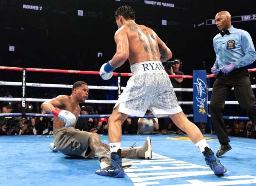 Ryan Garcia (white trunks) flattens Devin Haney during their fight last month in New York