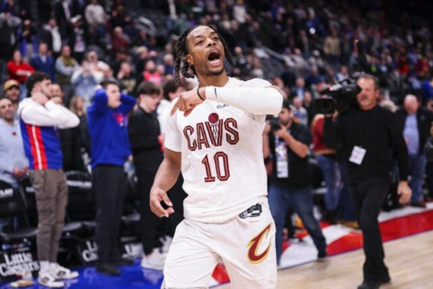 Darius Garland of the Cleveland Cavaliers reacts after making a buzzer-beating three-point