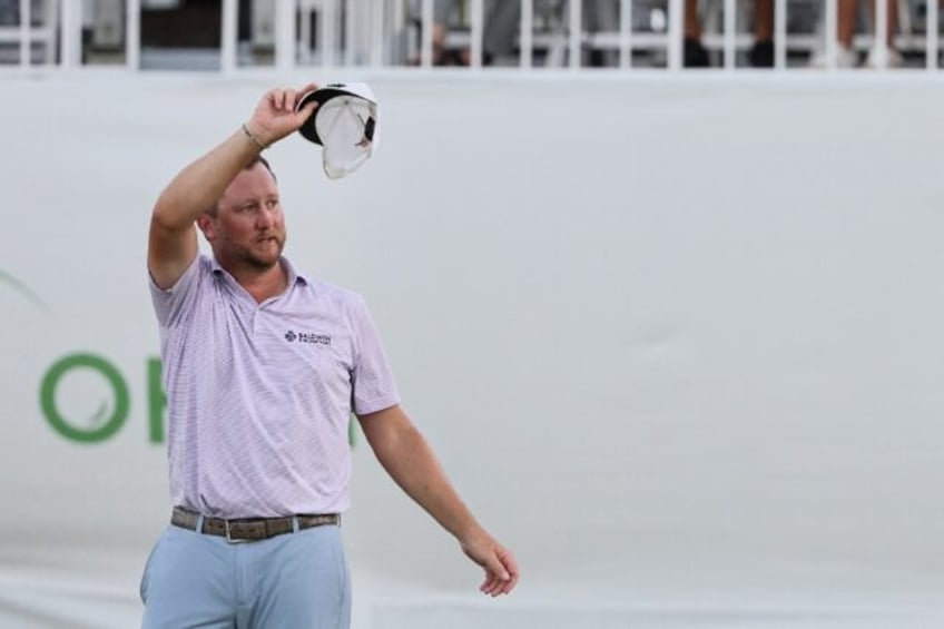 Brice Garnett of the United States celebrates his PGA Puerto Rico Open victory after a bir