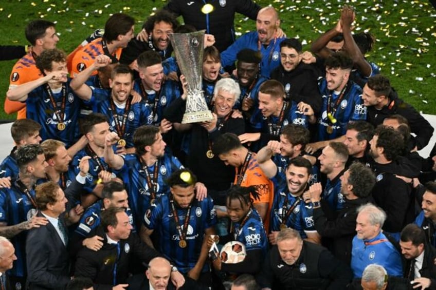 'Wonderful': Atalanta coach Gian Piero Gasperini and his players celebrate winning the Eur