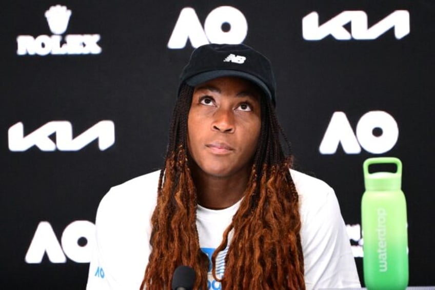 Coco Gauff talks to reporters following her quarter-final defeat to Paula Badosa