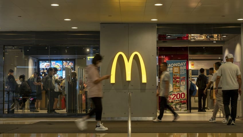 Customers can be seen walking outside one of the nation's largest fast-food chains, McDonald's. (Getty Images)