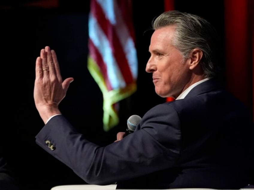 California Gov. Gavin Newsom, right, holds a fireside chat with Stephen Cheung, the Presid