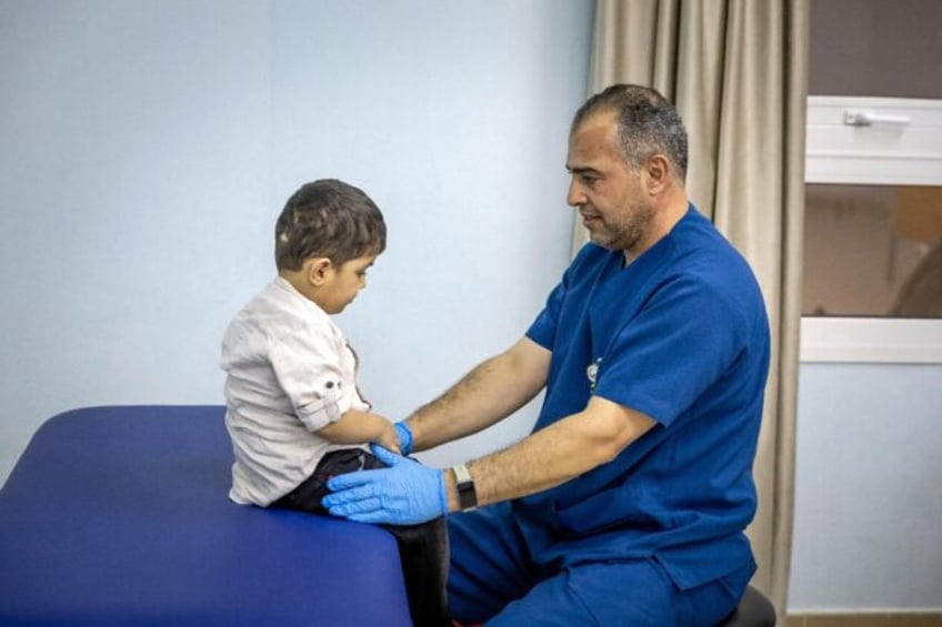 A doctor in Abu Dhabi cares for a Palestinian child injured in the Gaza Strip during the w