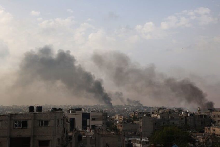 Smoke billows following Israeli strikes on Rafah city in the southern Gaza Strip on May 28