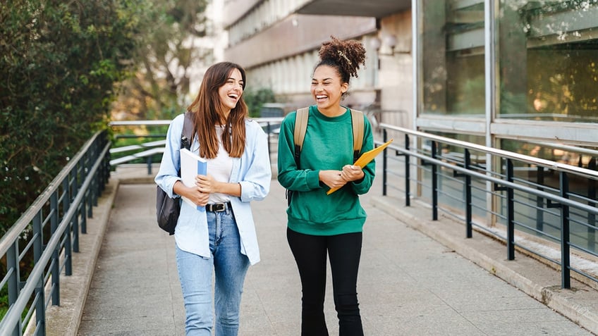 female students walk to class