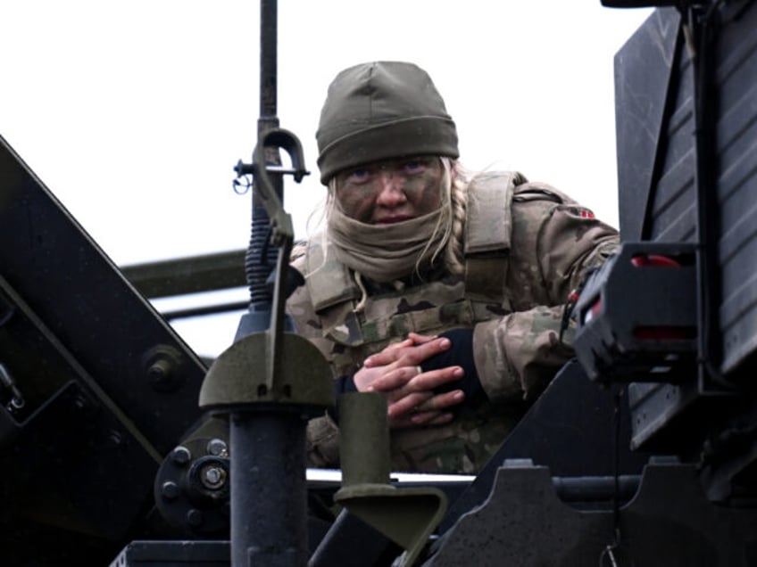 OKSBOL, DENMARK - MARCH 30: A female soldier looks on during Dynamic Front military exerci