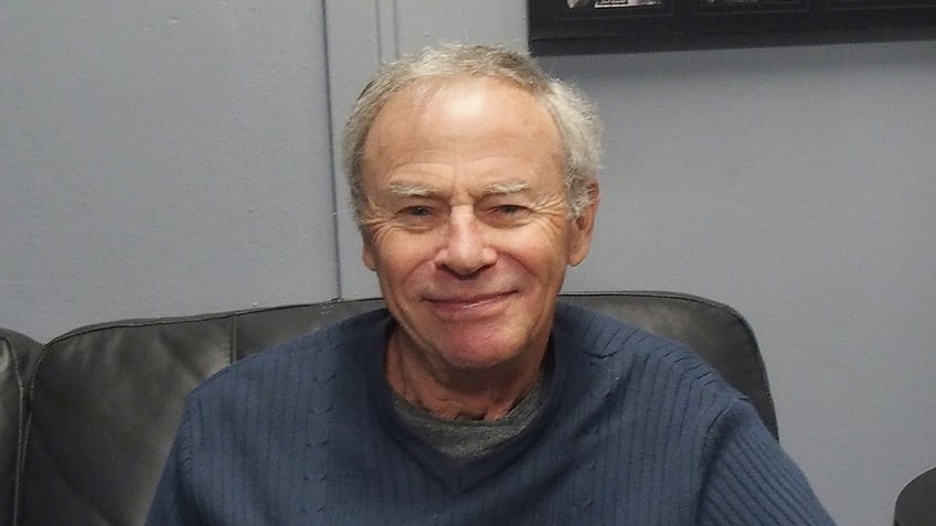 Tristan Rogers wears blue sweater