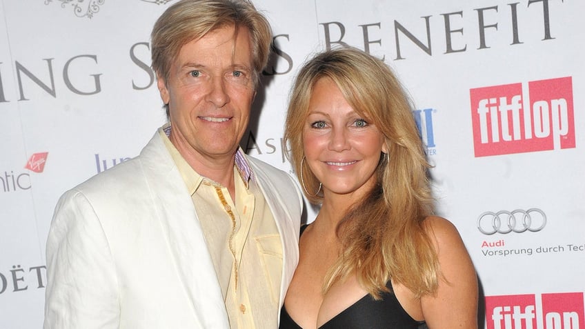Jack Wagner and Heather Locklear on a red carpet