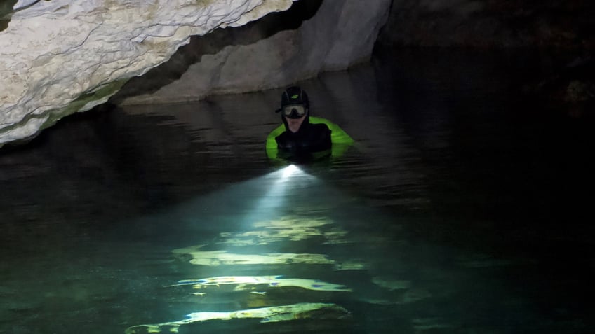 A diver in a cave