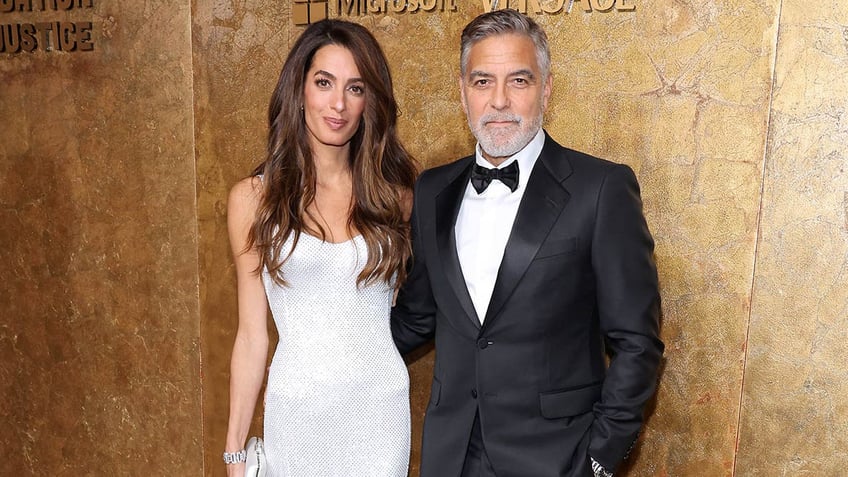 george clooney admits wife amal does the heavy lifting good team effort