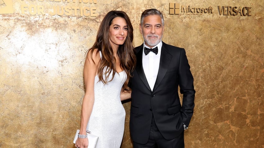 george clooney admits wife amal does the heavy lifting good team effort