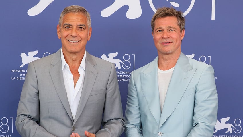 George Clooney and Brad Pitt at an event