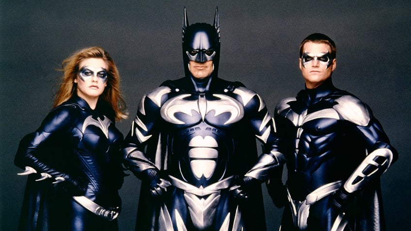 Alicia Silverstone, George Clooney and Chris O'Donnell in the film "Batman & Robin" all in costume