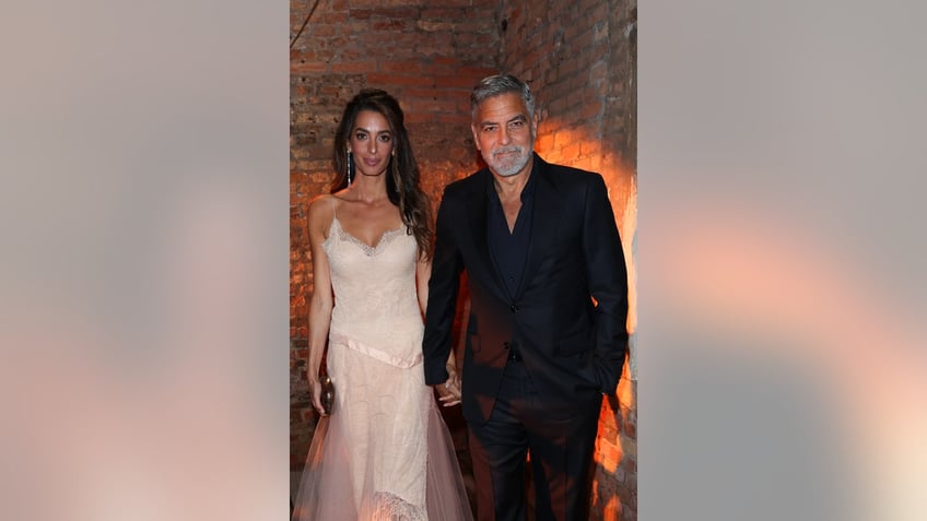 george clooney plays leading man to wife amal in venice as she receives major honor