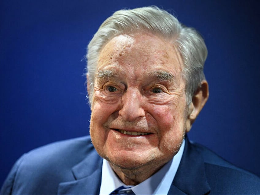 Hungarian-born US investor and philanthropist George Soros smiles after delivering a speec