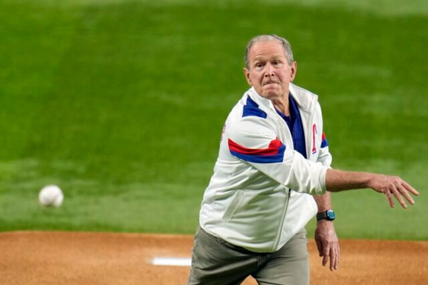 george w bush has a little bounce as he throws ceremonial first pitch to start world series