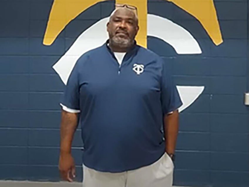 georgia high school football coach fired after holding baptism for 20 players