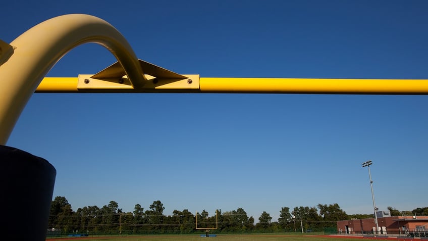 georgia high school football coach fired weeks after holding baptism ceremony following practice