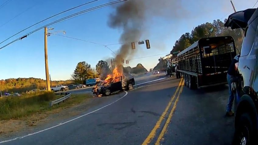 georgia officers save mom child from burning vehicle in dramatic video