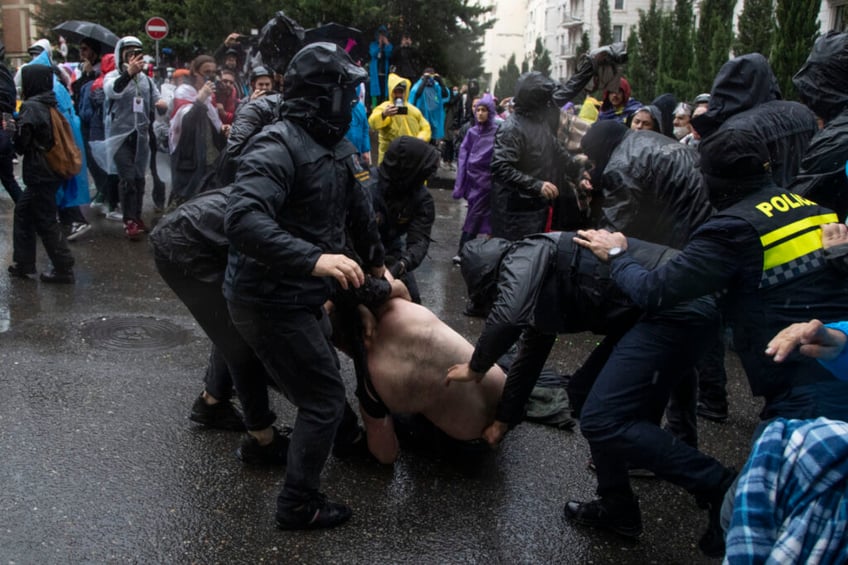 georgia passes foreign agent law despite massive protests parliament brawls