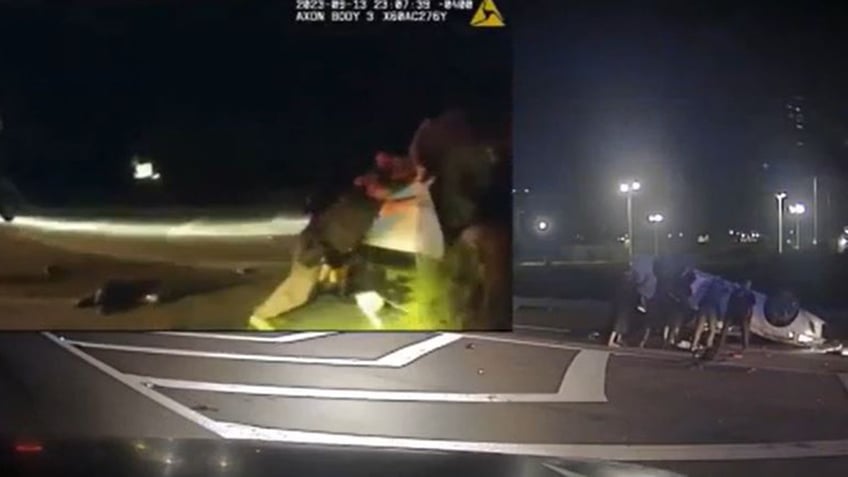 georgia police bystanders lift overturned car rescuing trapped driver