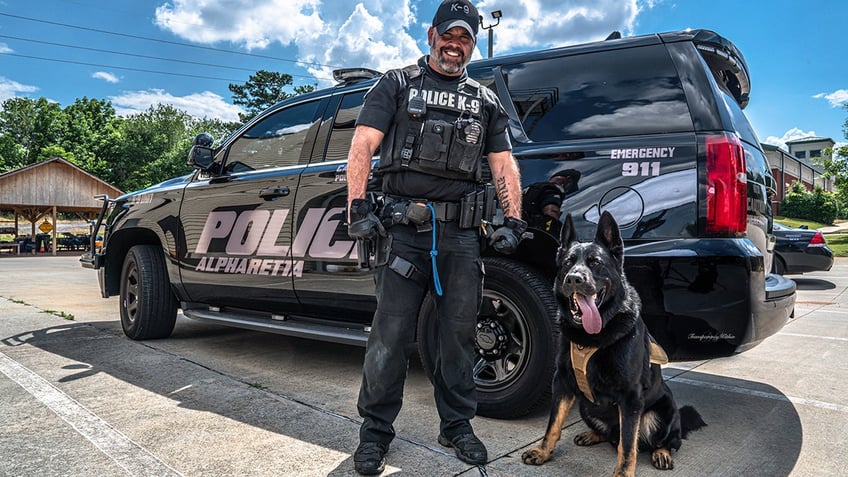 mark tappan and mattis in front of a police car