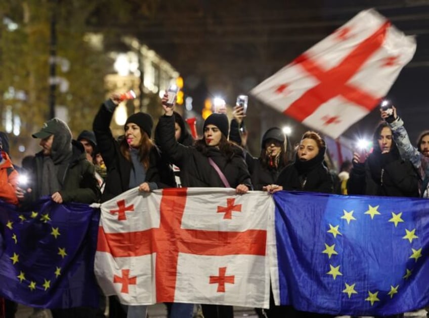 Thousands of protesters have thronged the streets of Tbilisi demanding the government cont