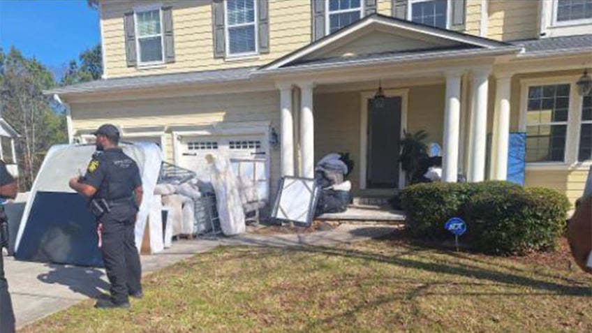 Police outside home with squatters