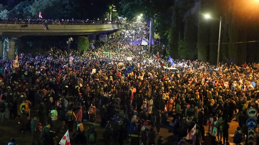 A massive crowd of demonstrators fills the Square of Heroes during an opposition protest against 