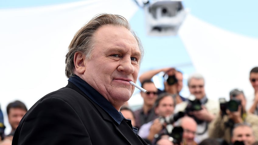 Gerard Depardieu wears black on the red carpet