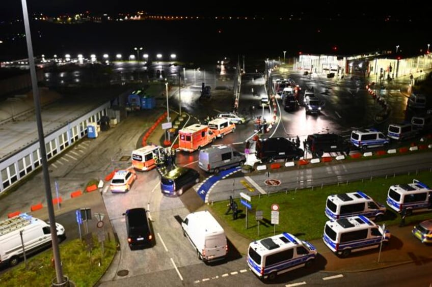 german airport closed after armed man breaches security with his car