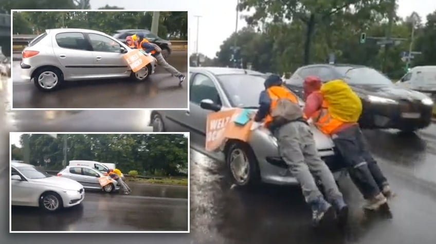 german driver erupts in anger as he slaps and grabs radical climate protester blocking road in berlin