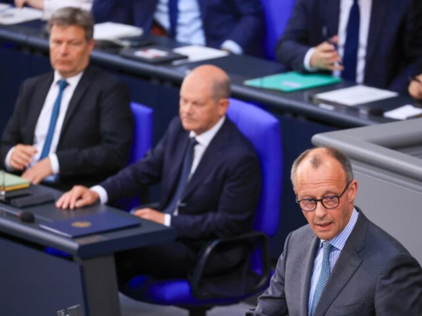 Friedrich Merz, leader of the Christian Democratic Union (CDU), right, Olaf Scholz, German