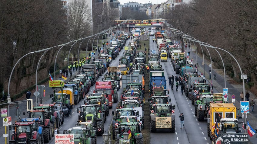 Farmers in Germany clog the streets of Berlin with their tractors in protest