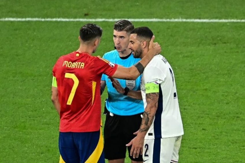 French referee François Letexier speaks with Spain captain Alvaro Morata and England capt