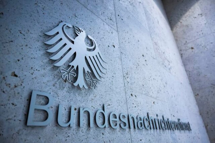 german intelligence employee and acquaintance charged with treason for passing secrets to russia