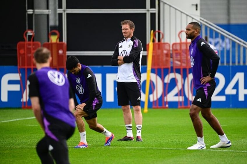 Germany coach Julian Nagelsmann (C) watches the Euro 2024 host nation in training on Wedne