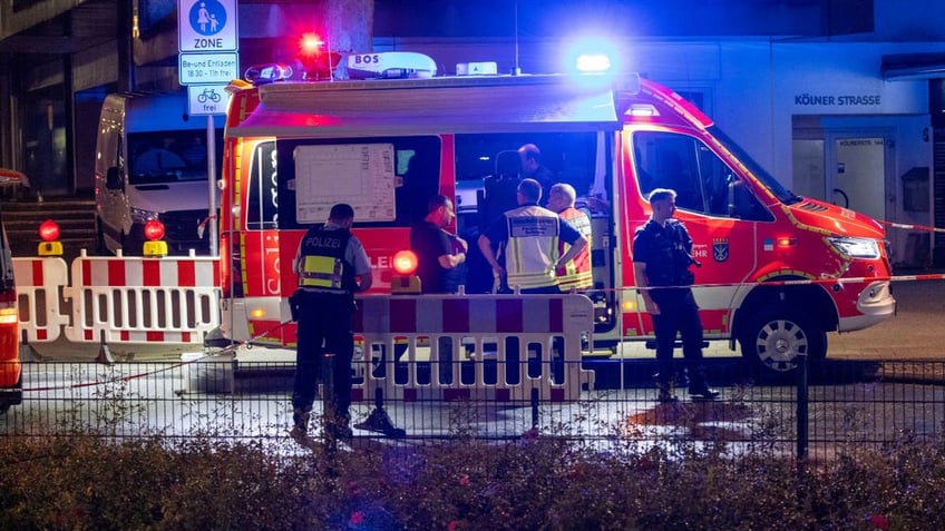 Emergency services and police at a stabbing scene in Germany Friday